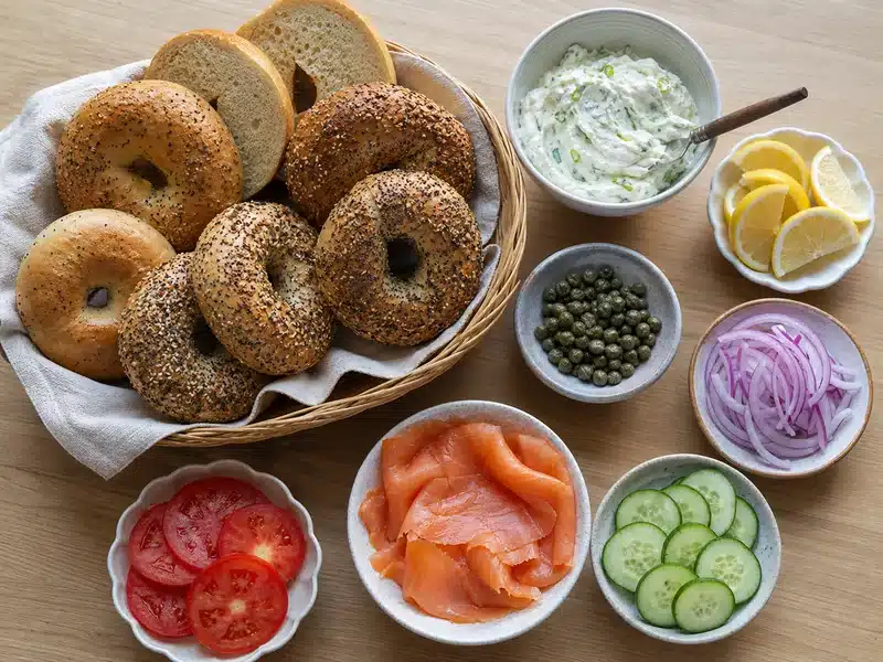 Bagel brunch board with smoked salmon cream cheese and vegetables - bagel bar | EpicureDelight