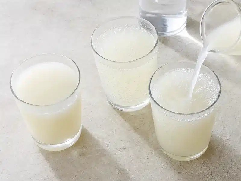Three pale cultured milk drinks showing still, fizzy, and diluted formats | EpicureDelight