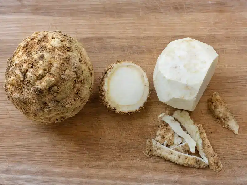 Fresh celery root trimmed and peeled for cooking - preparation | EpicureDelight