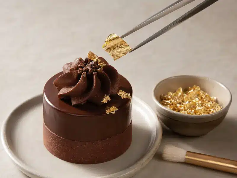 Edible gold leaf, flakes, and dust applied to desserts | EpicureDelight
