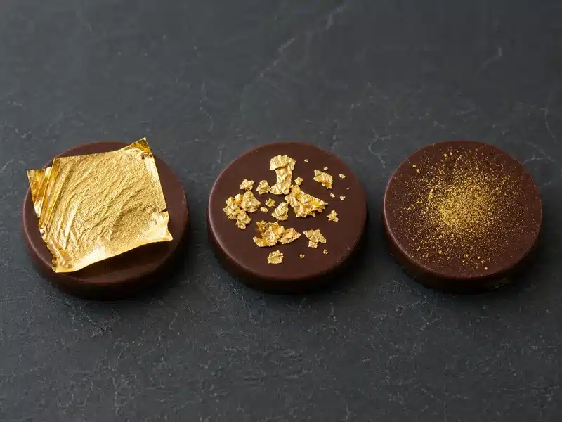 Edible gold leaf, flakes, and dust on small desserts | EpicureDelight