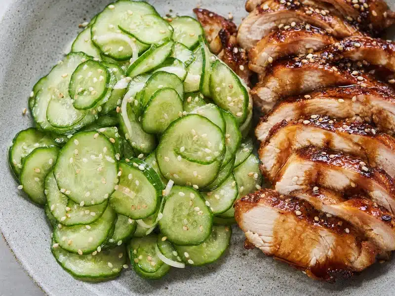 Sesame cucumber salad beside teriyaki chicken - teriyaki side dish | EpicureDelight