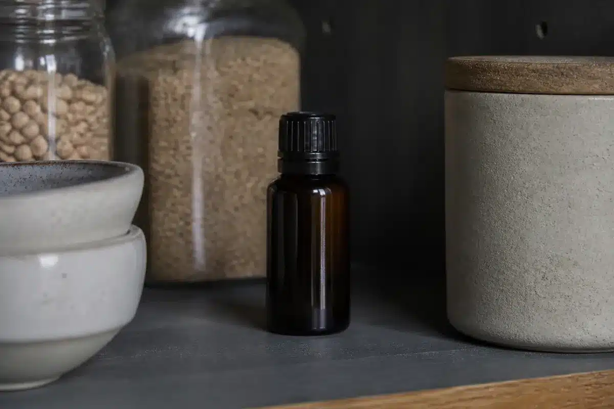 Small dark truffle oil bottle stored upright in a shaded pantry - truffle oil storage | EpicureDelight